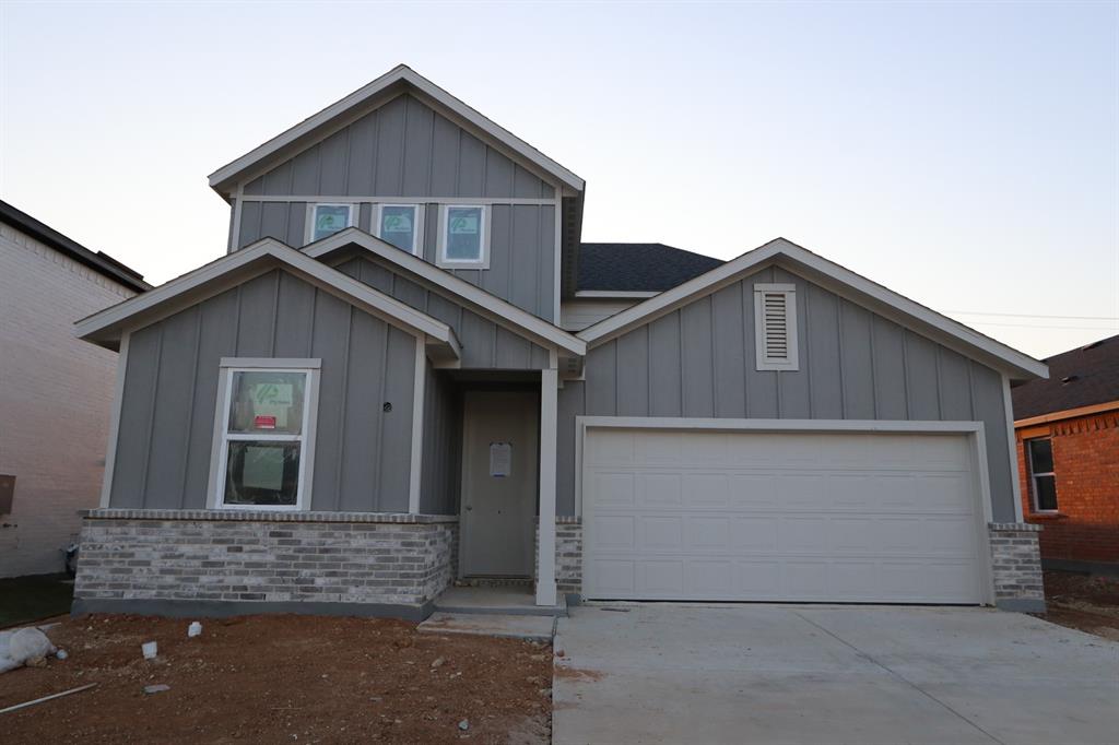 a front view of house with garage