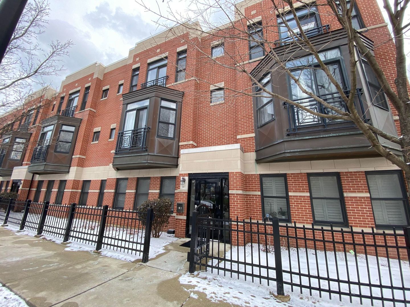 a view of a brick building with many windows