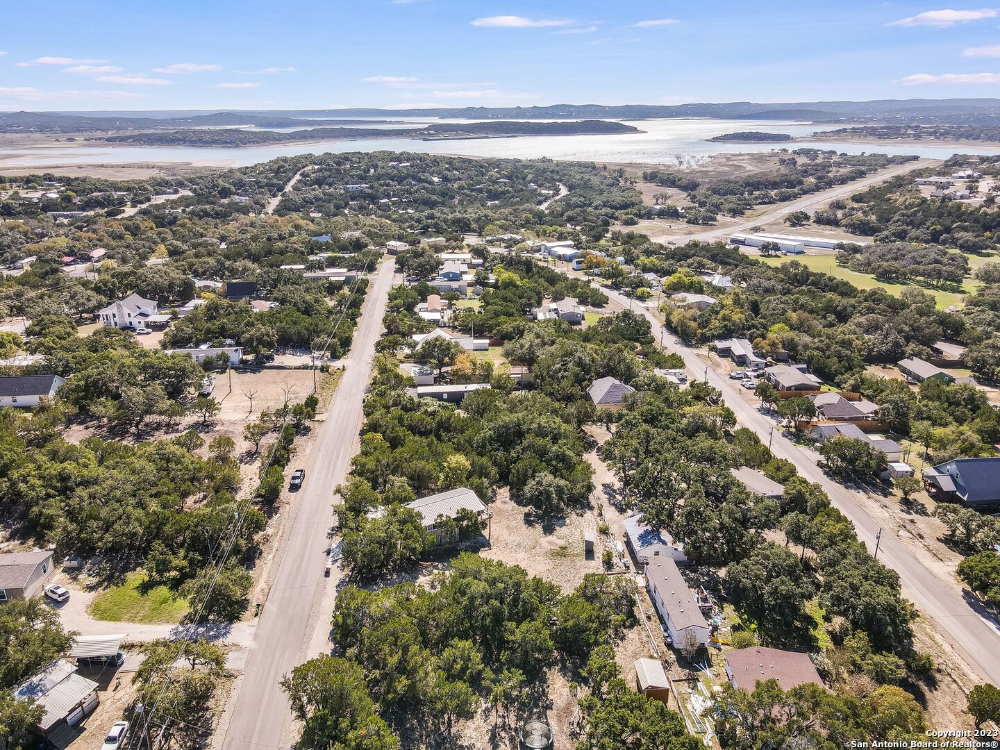 an aerial view of residential houses with outdoor space