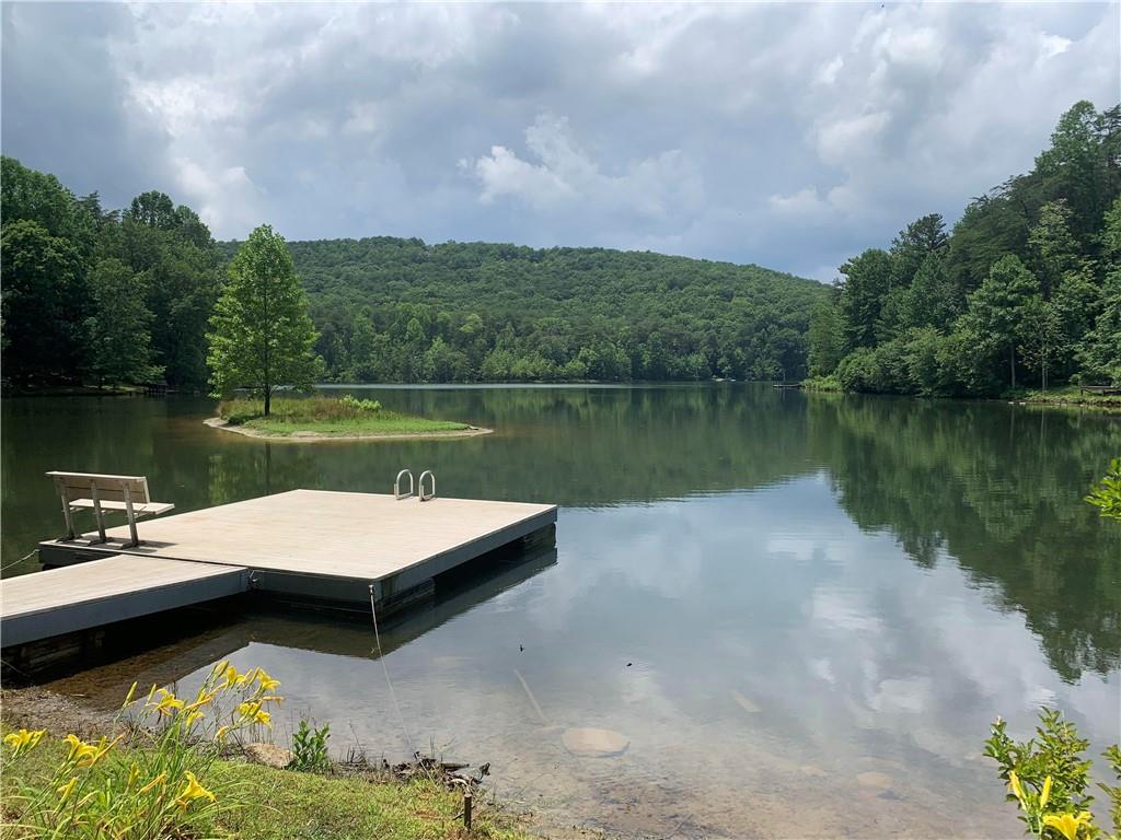 a view of a lake with sitting area