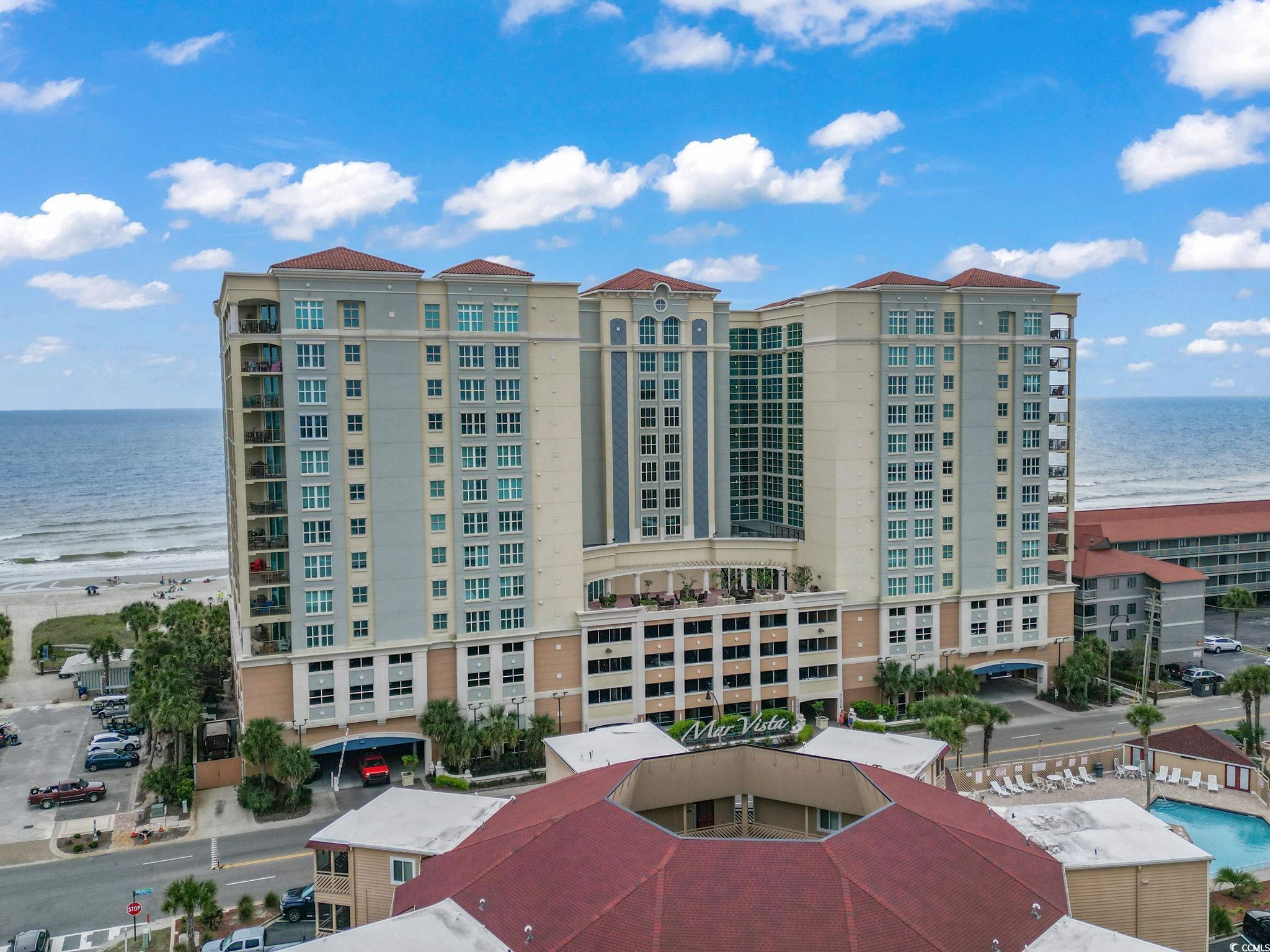 View of building exterior featuring a water view a