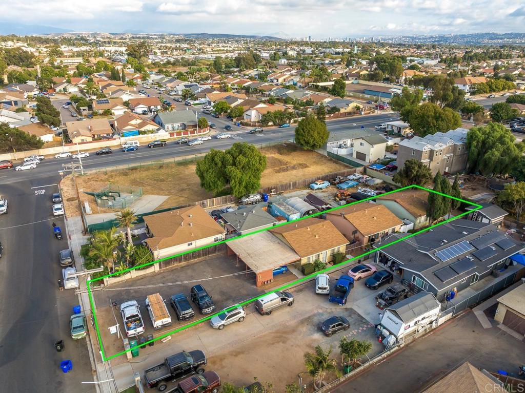 an aerial view of residential houses with outdoor space