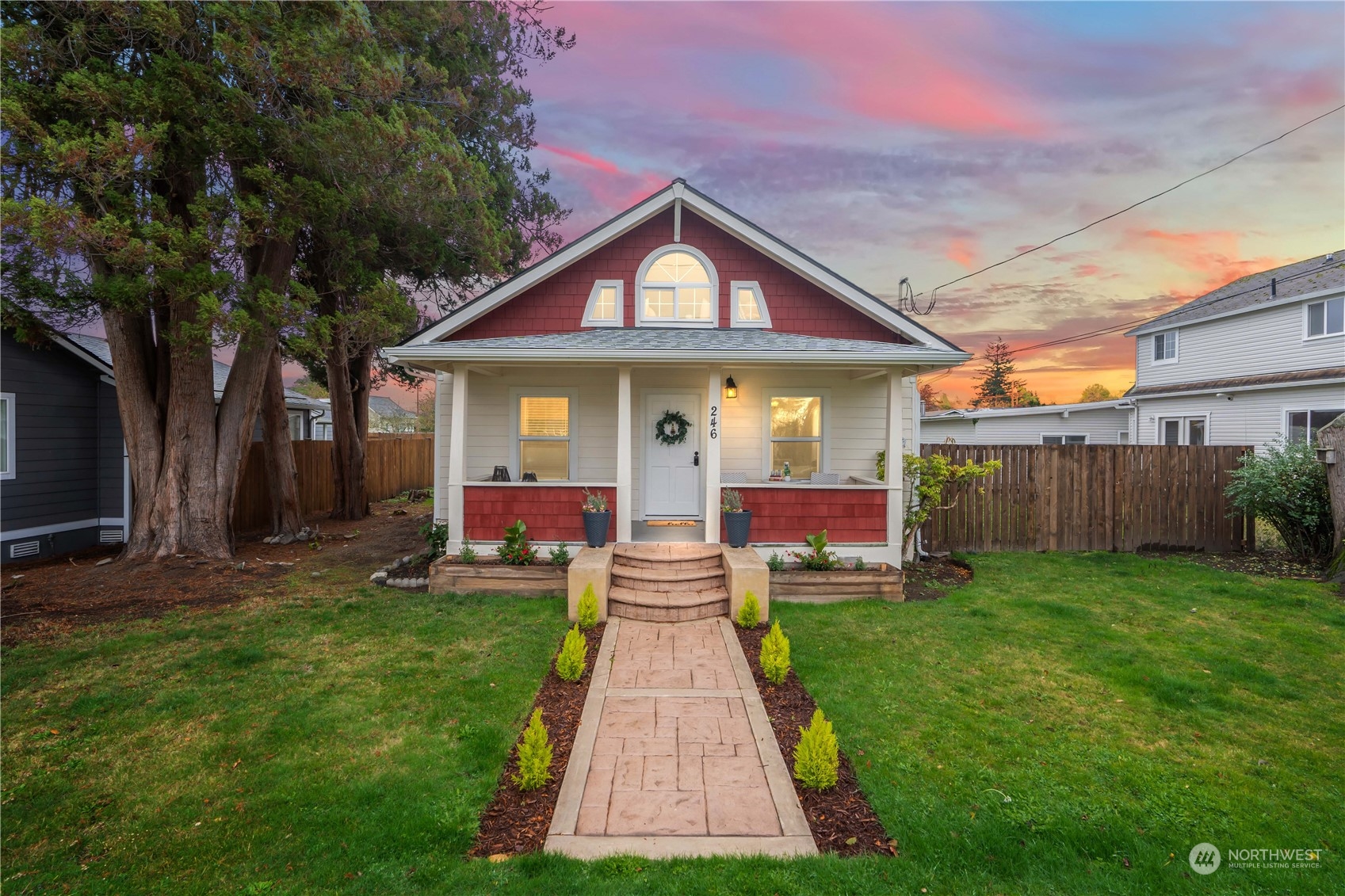 a front view of a house with a yard and porch