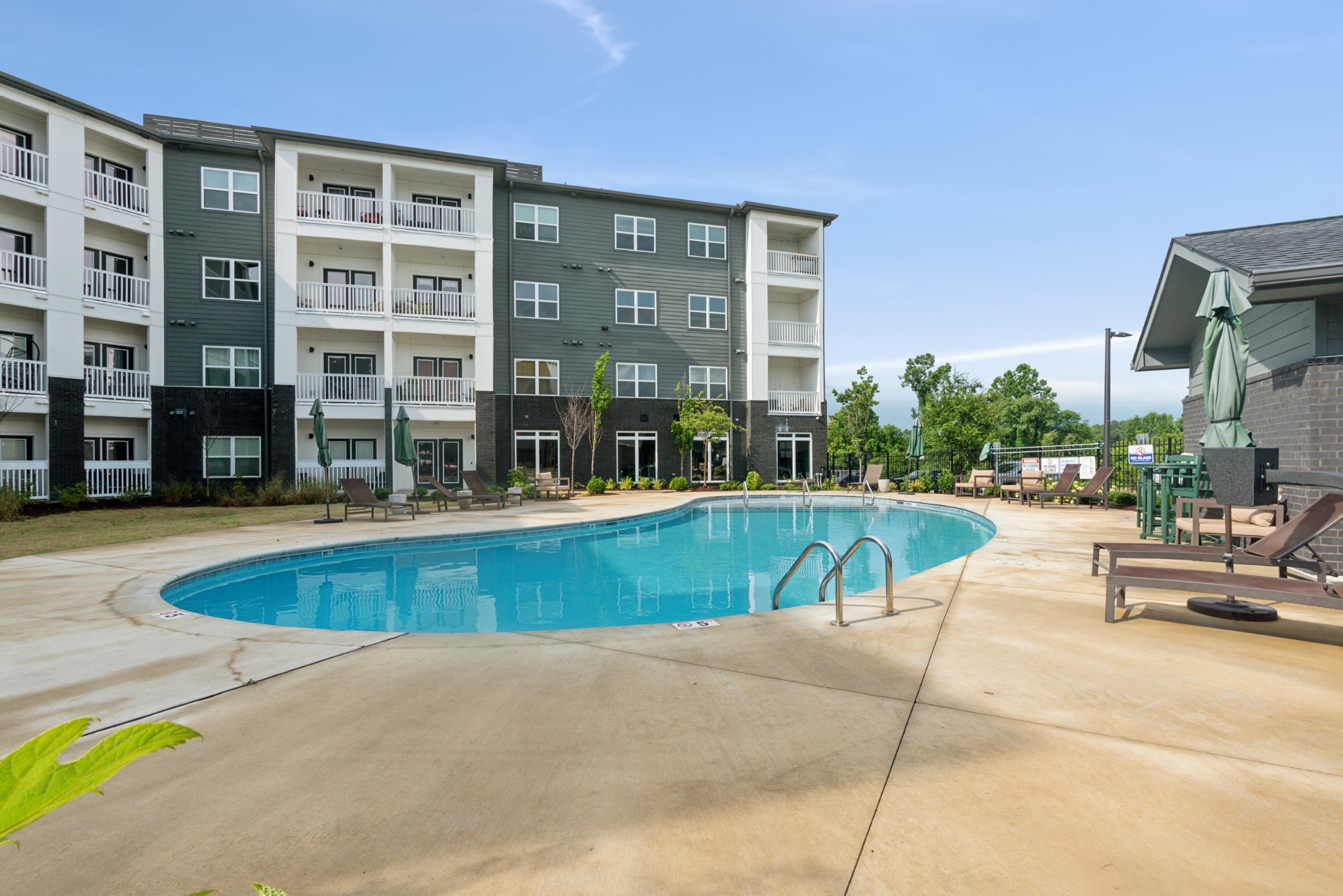 a view of swimming pool with outdoor seating