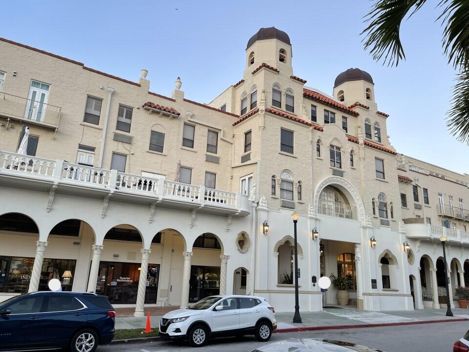 a front view of a building with parking space