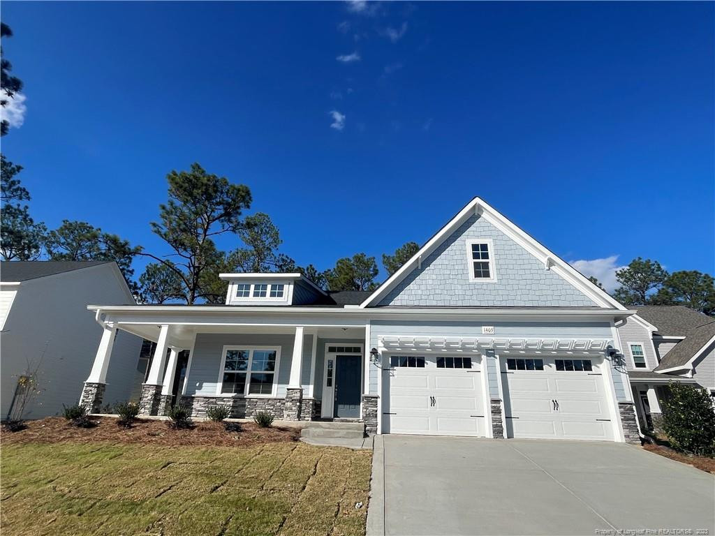 a front view of a house with garage