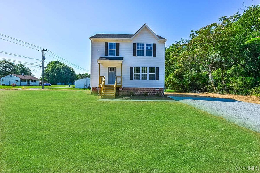 a front view of a house with a yard