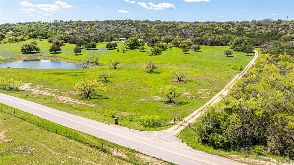 Welcome to your 56.13 Acres with a Tiny Home, 4 Car Garage with HVAC, 3 Water Tanks and an Ag Exemption. No HOA and a very low tax rate of 1.29%.