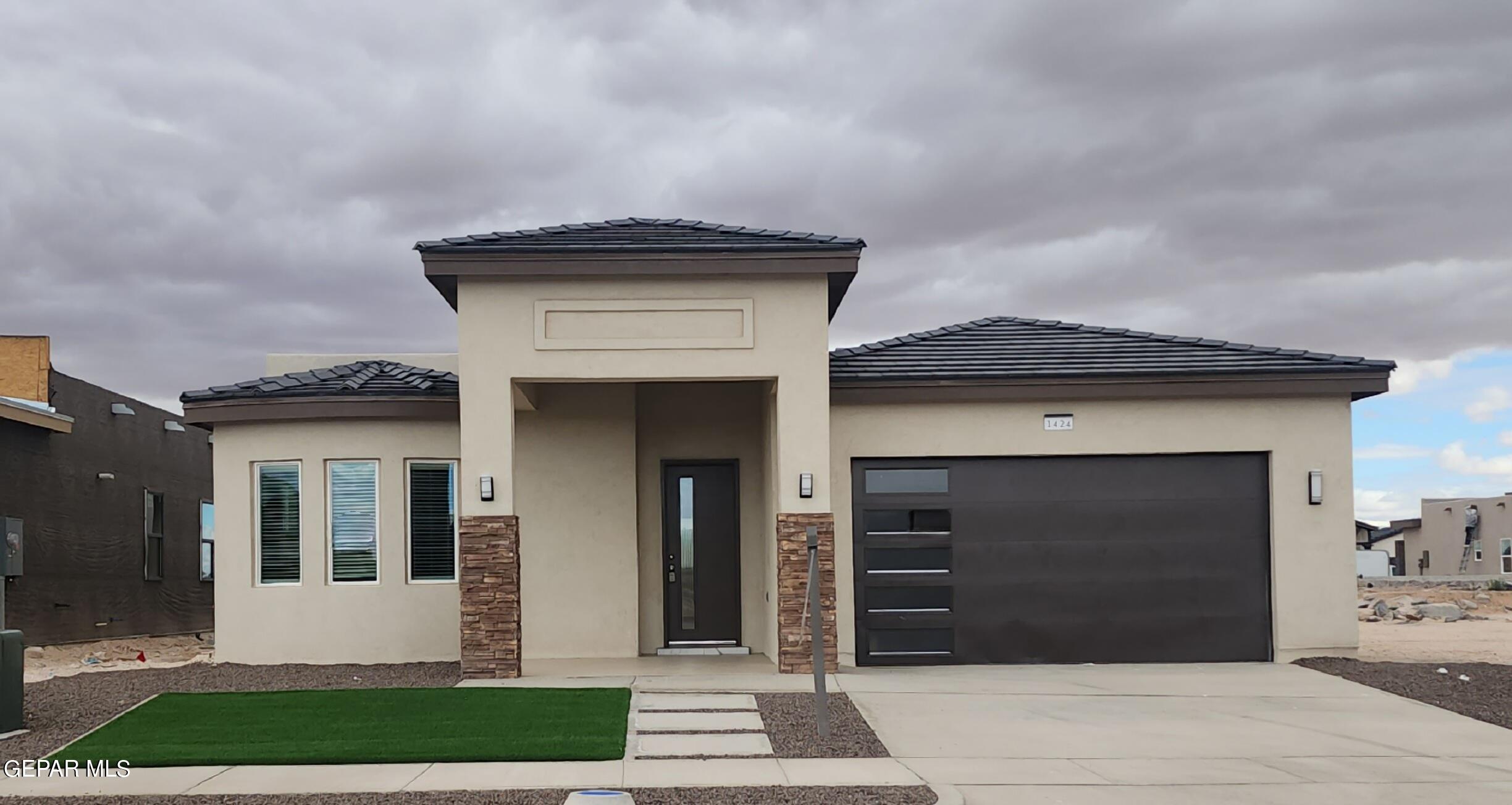 a view of house with garage