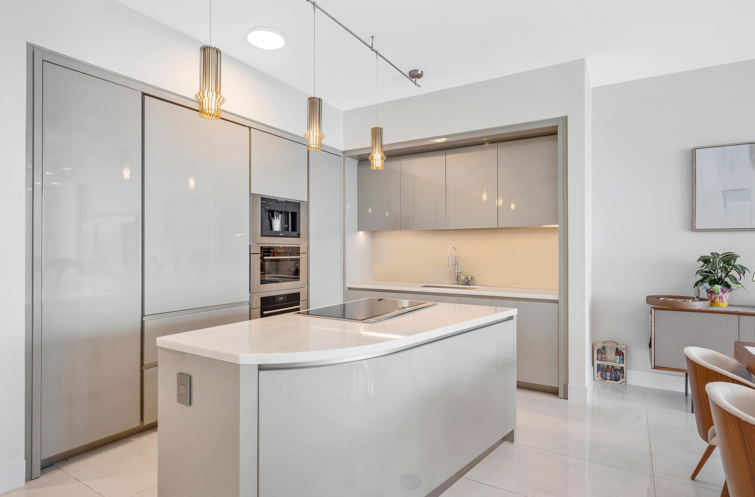 a kitchen with a sink appliances and cabinets