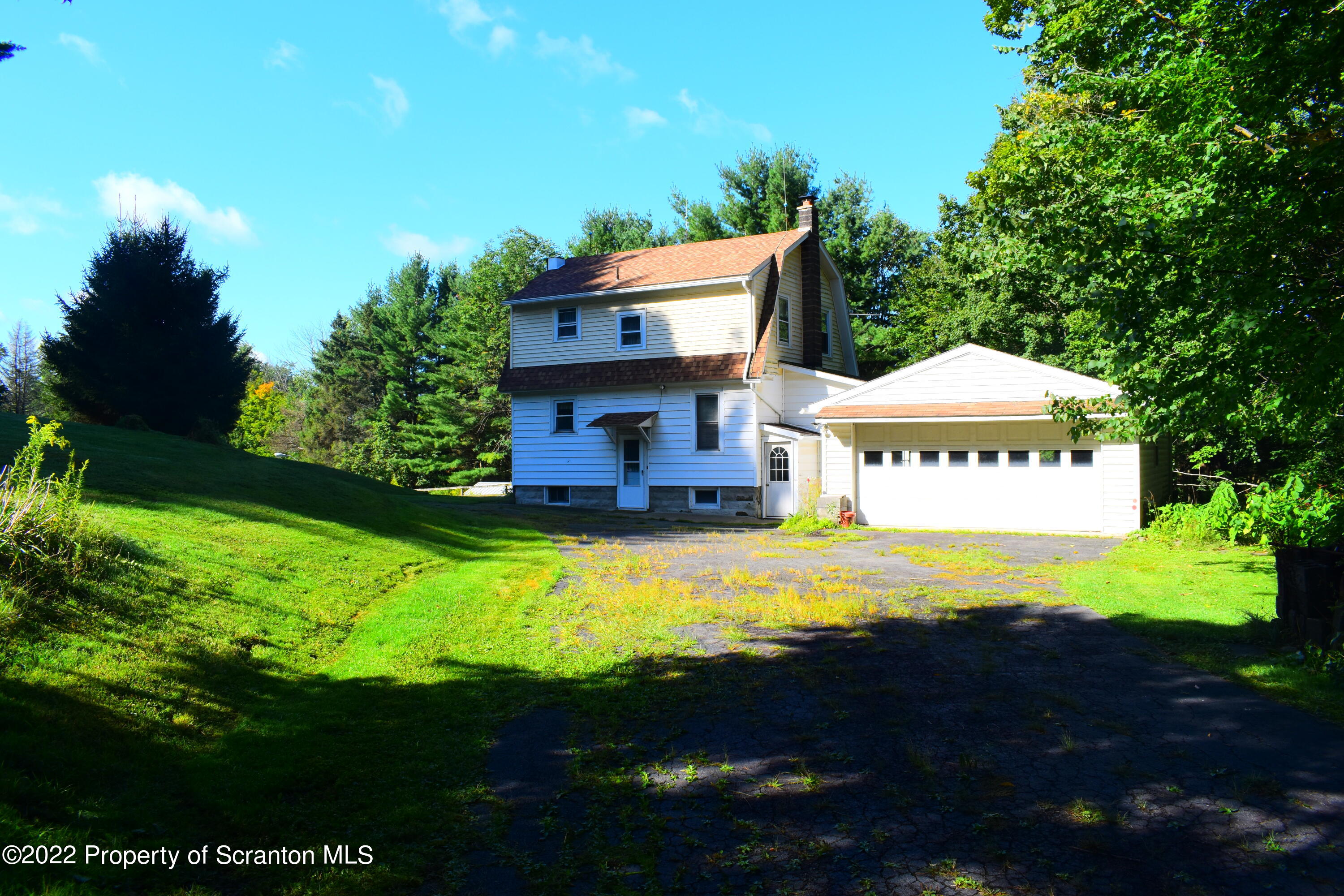 a view of a house with a big yard