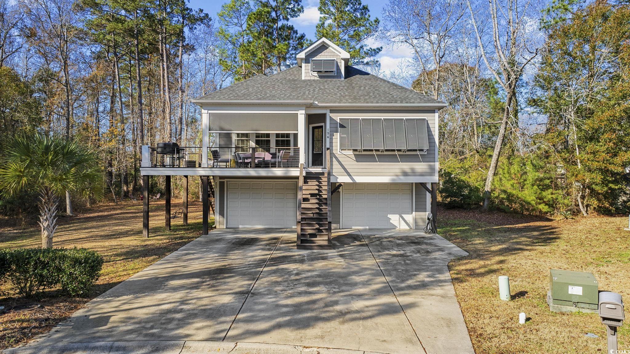 View of front of home featuring a garage