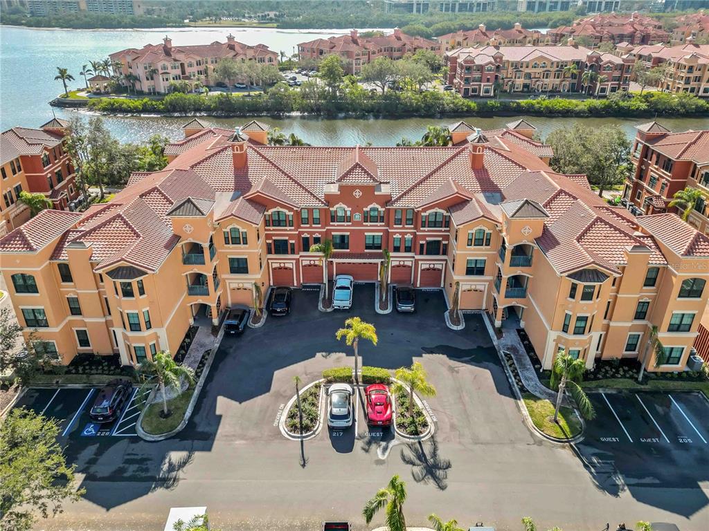 an aerial view of a house with outdoor space and lake view