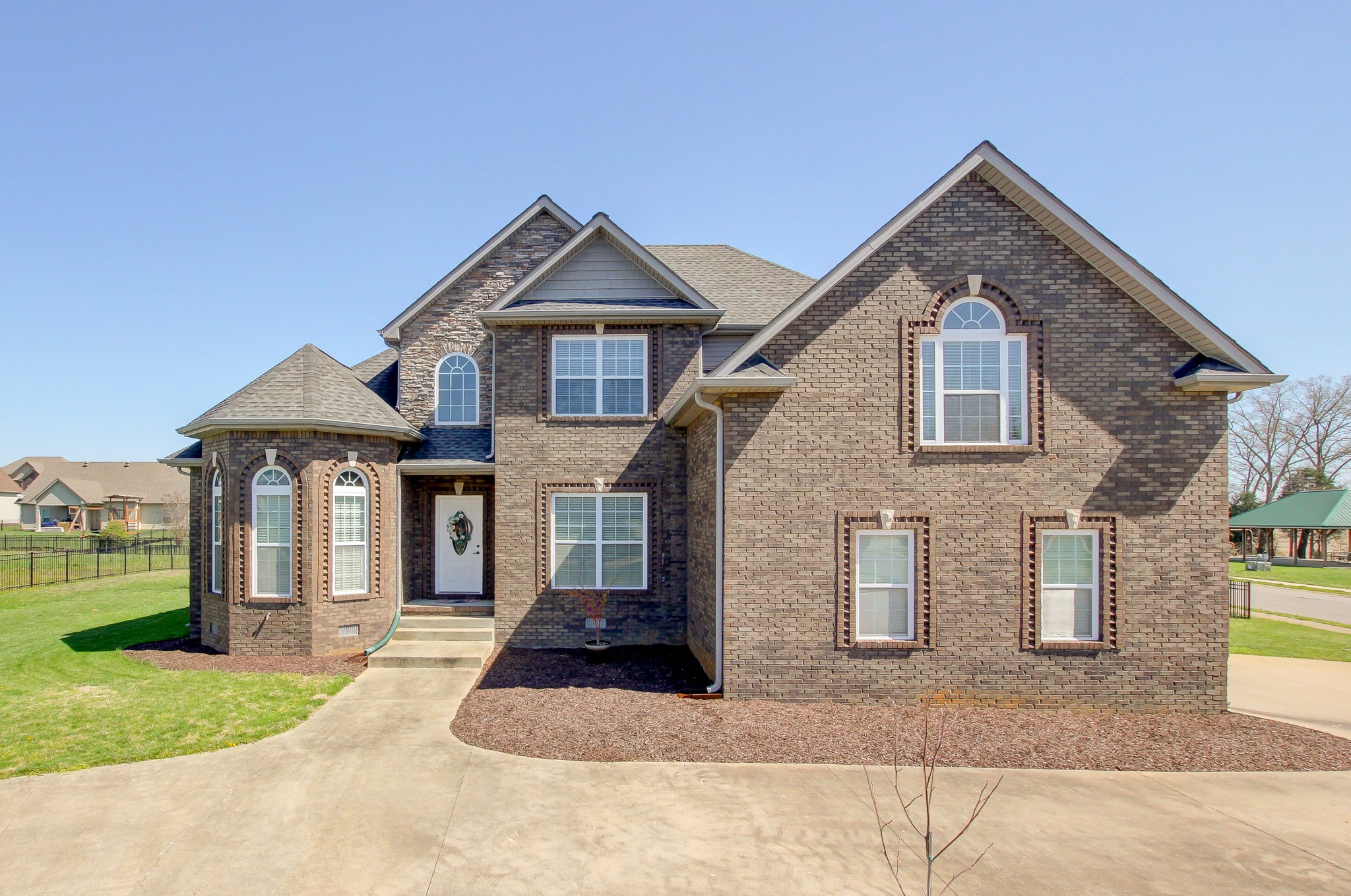 a front view of a house with a yard