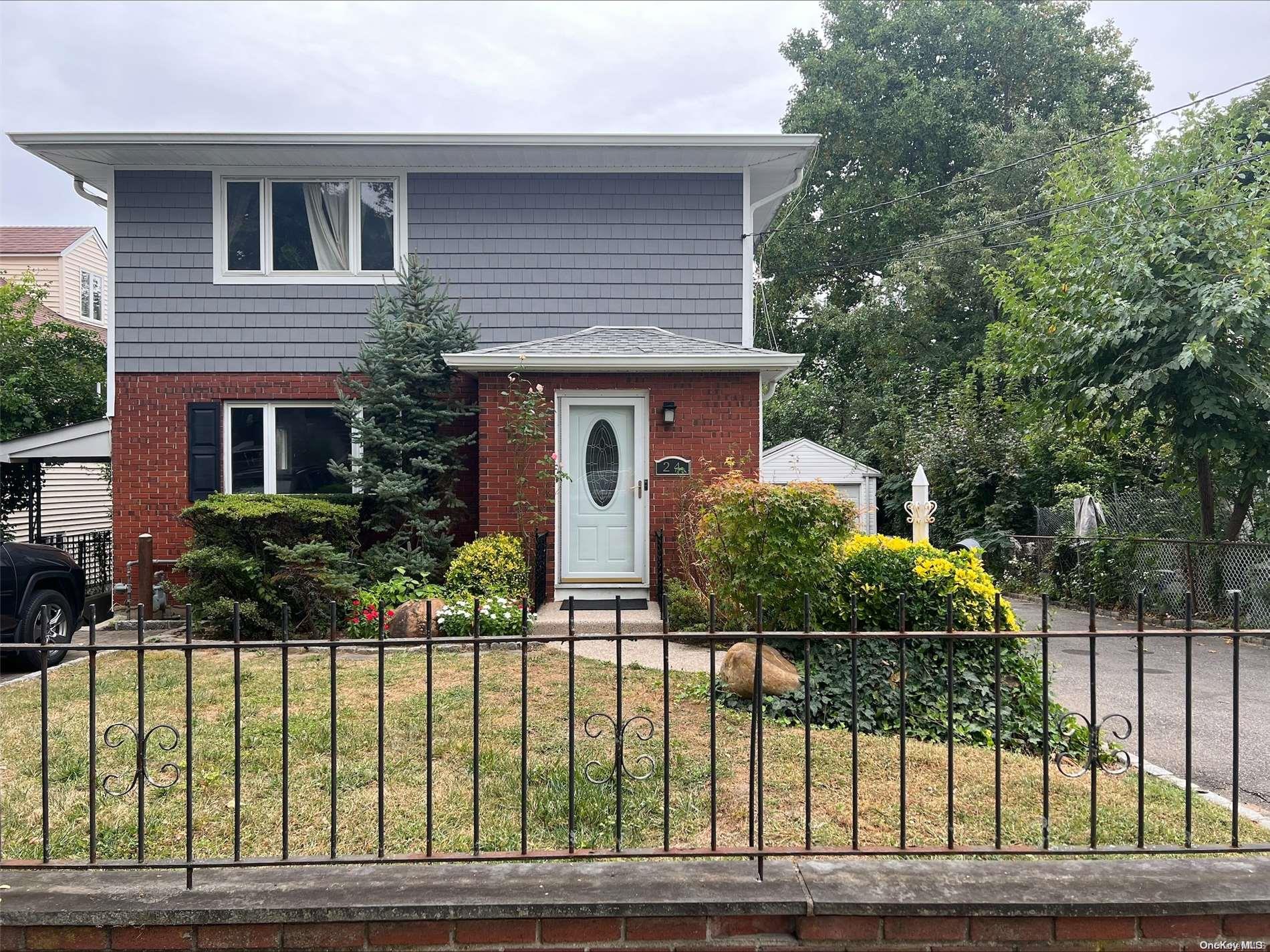 a front view of a house having yard