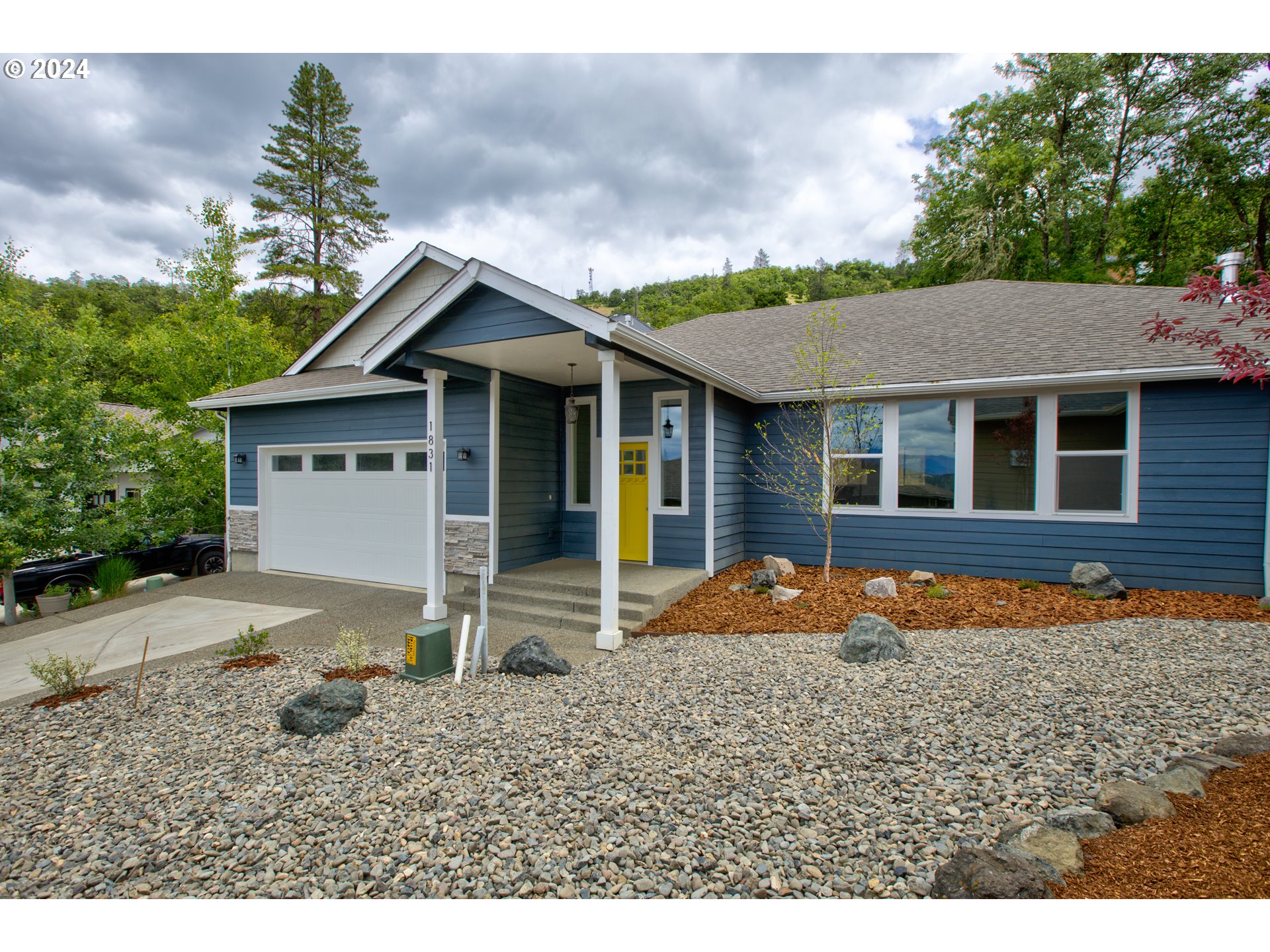 a front view of a house with a yard