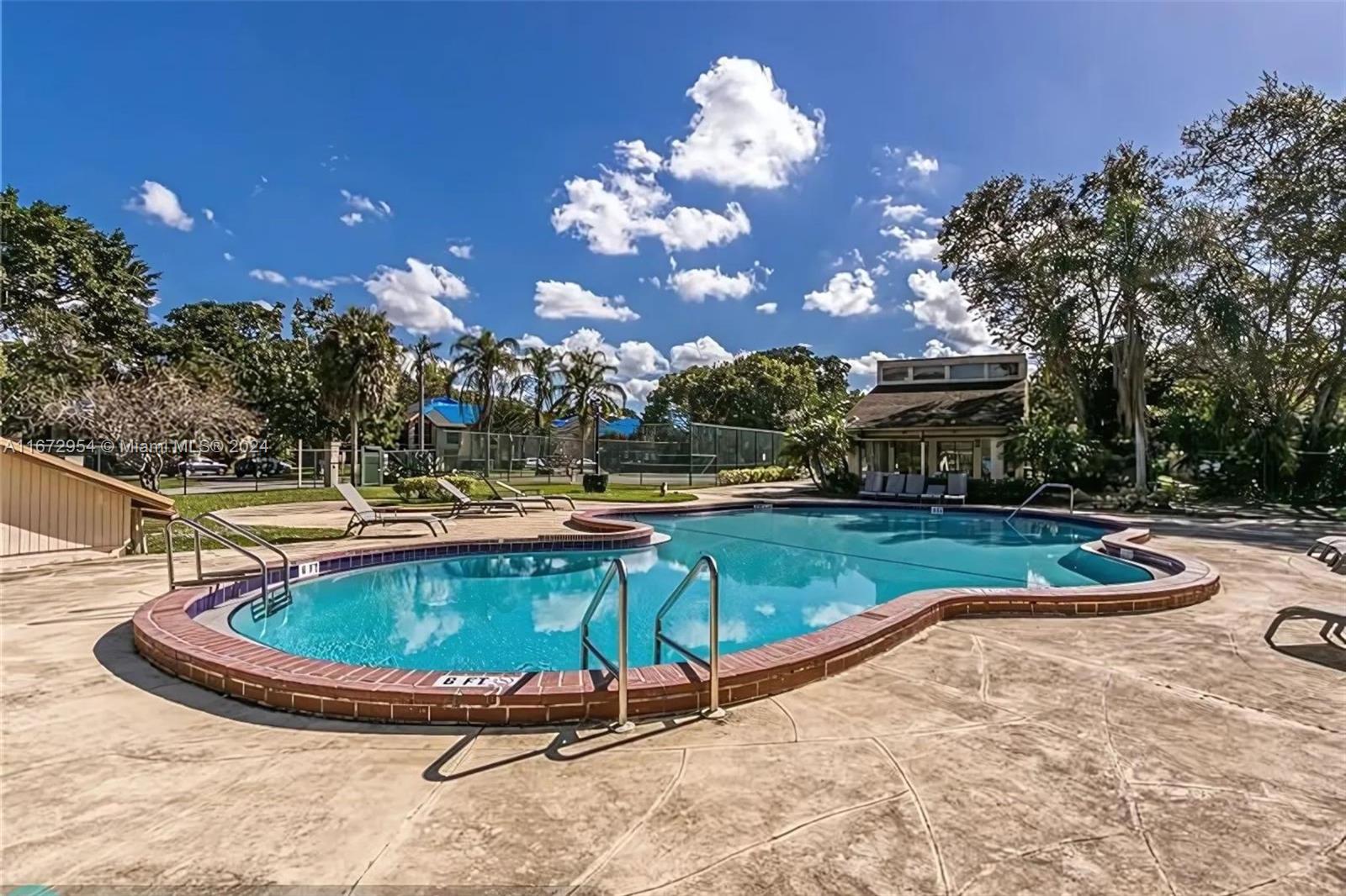 a view of a swimming pool with a patio