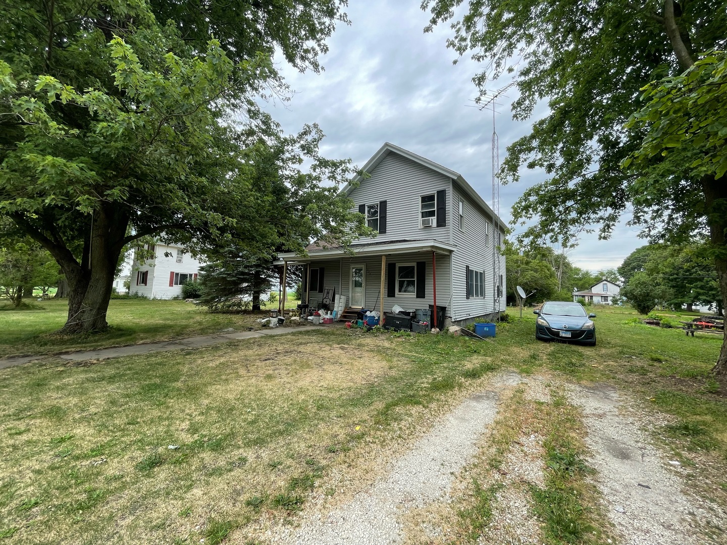 a view of house with outdoor space and garden