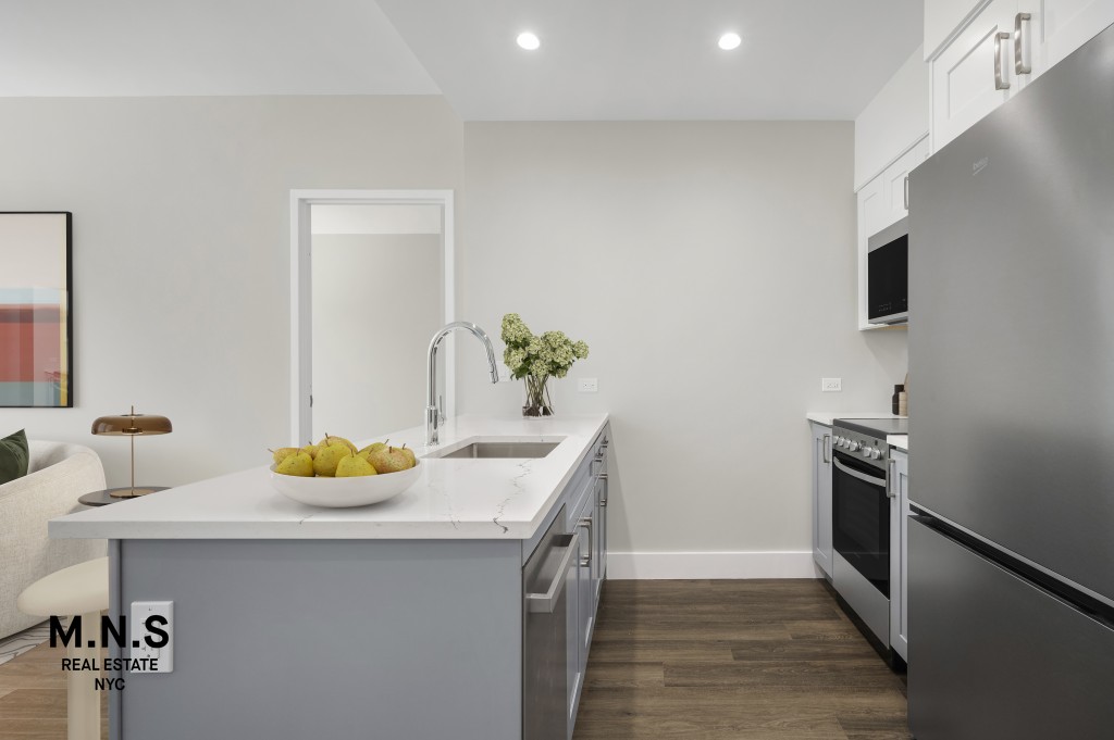 a kitchen with a sink and refrigerator