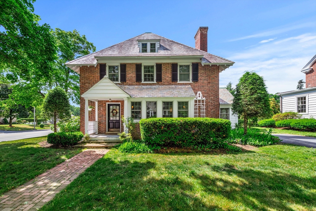 a front view of a house with a yard