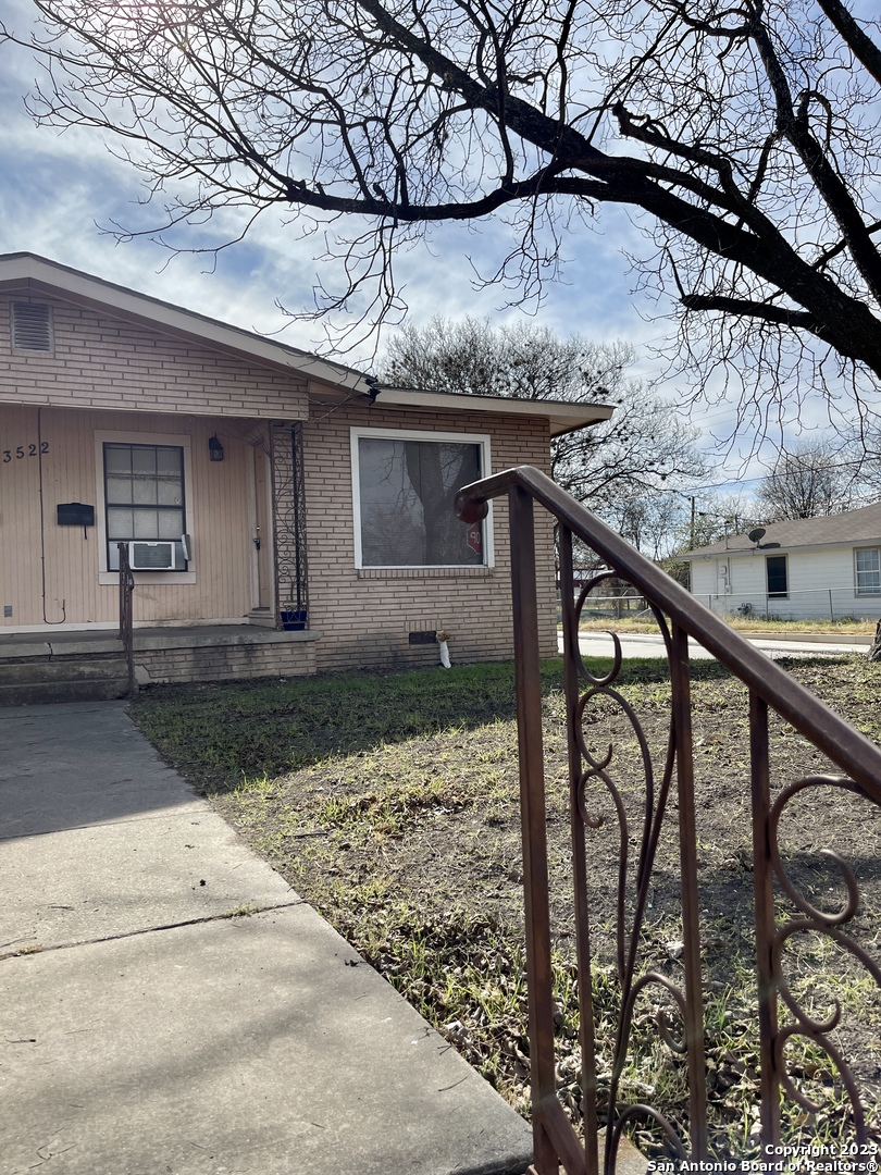 a front view of a house with yard and garage