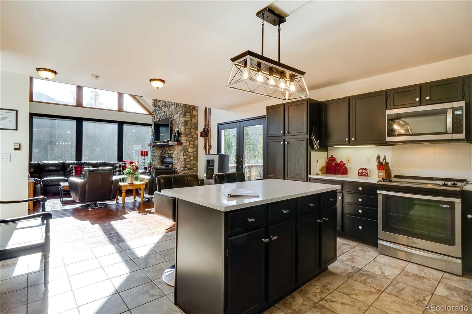 a kitchen with a counter space cabinets and stainless steel appliances