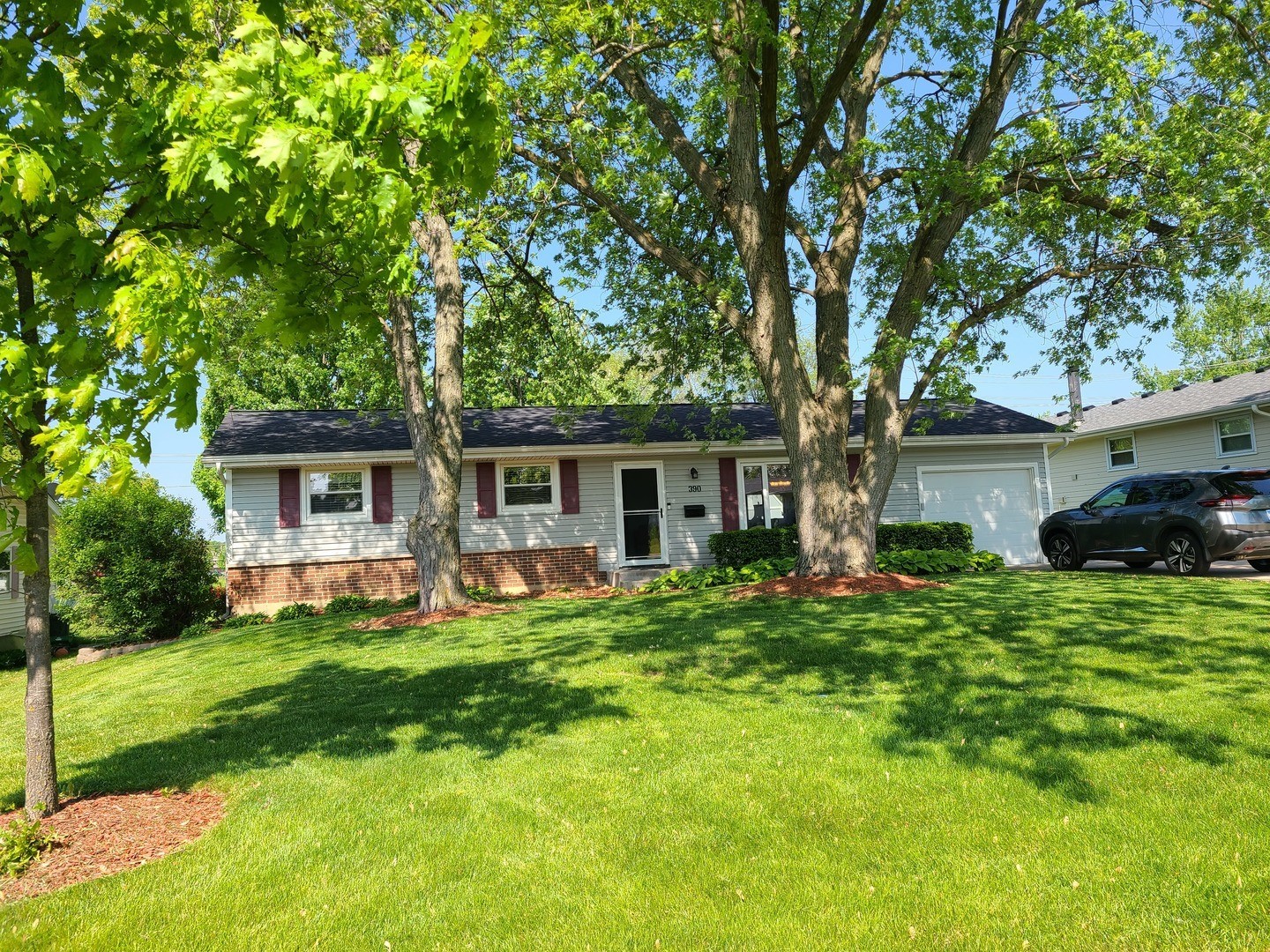 a front view of house with yard and green space