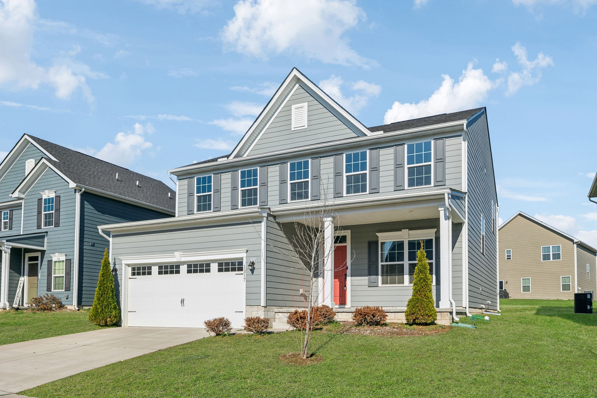 a front view of a house with a yard