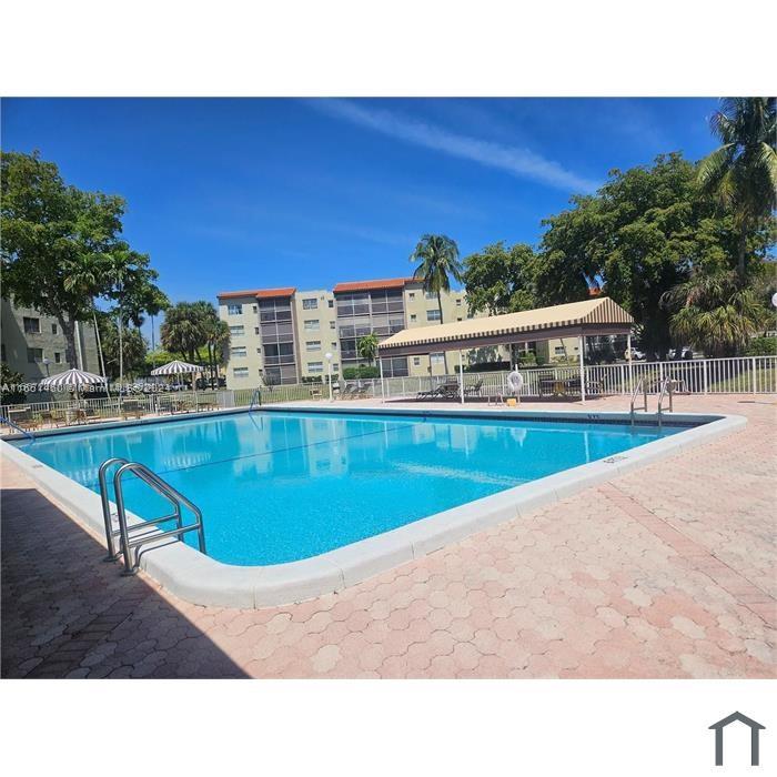 a view of a swimming pool with a chair