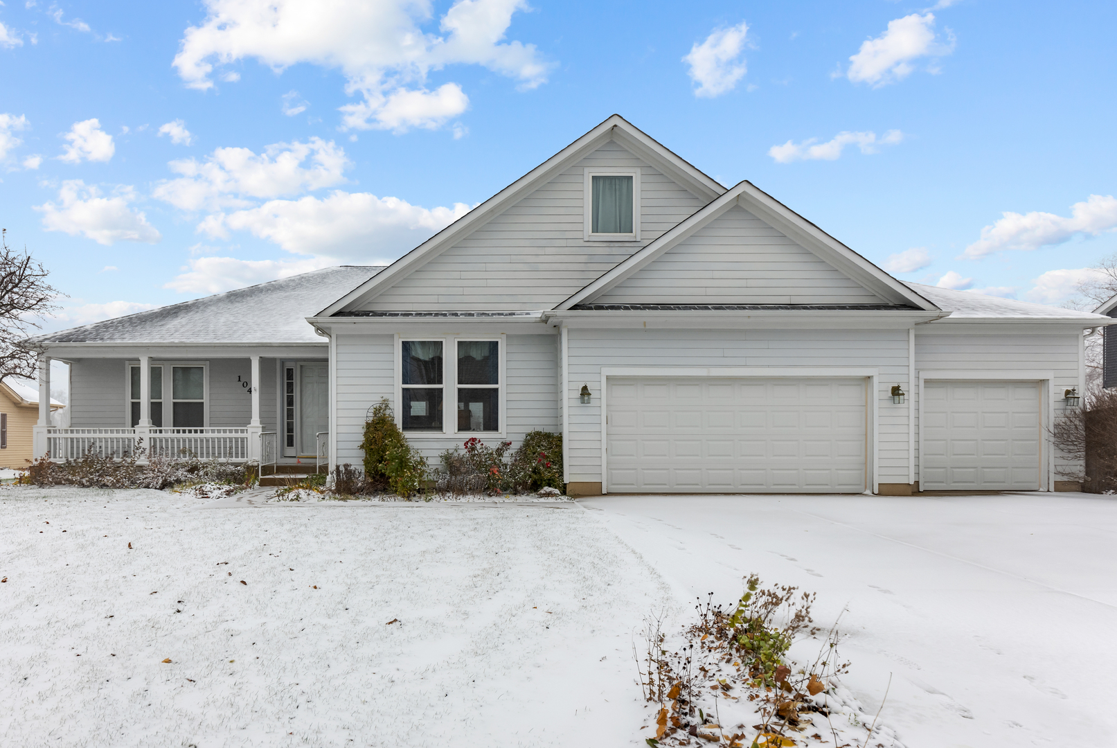 a front view of house with garage and yard