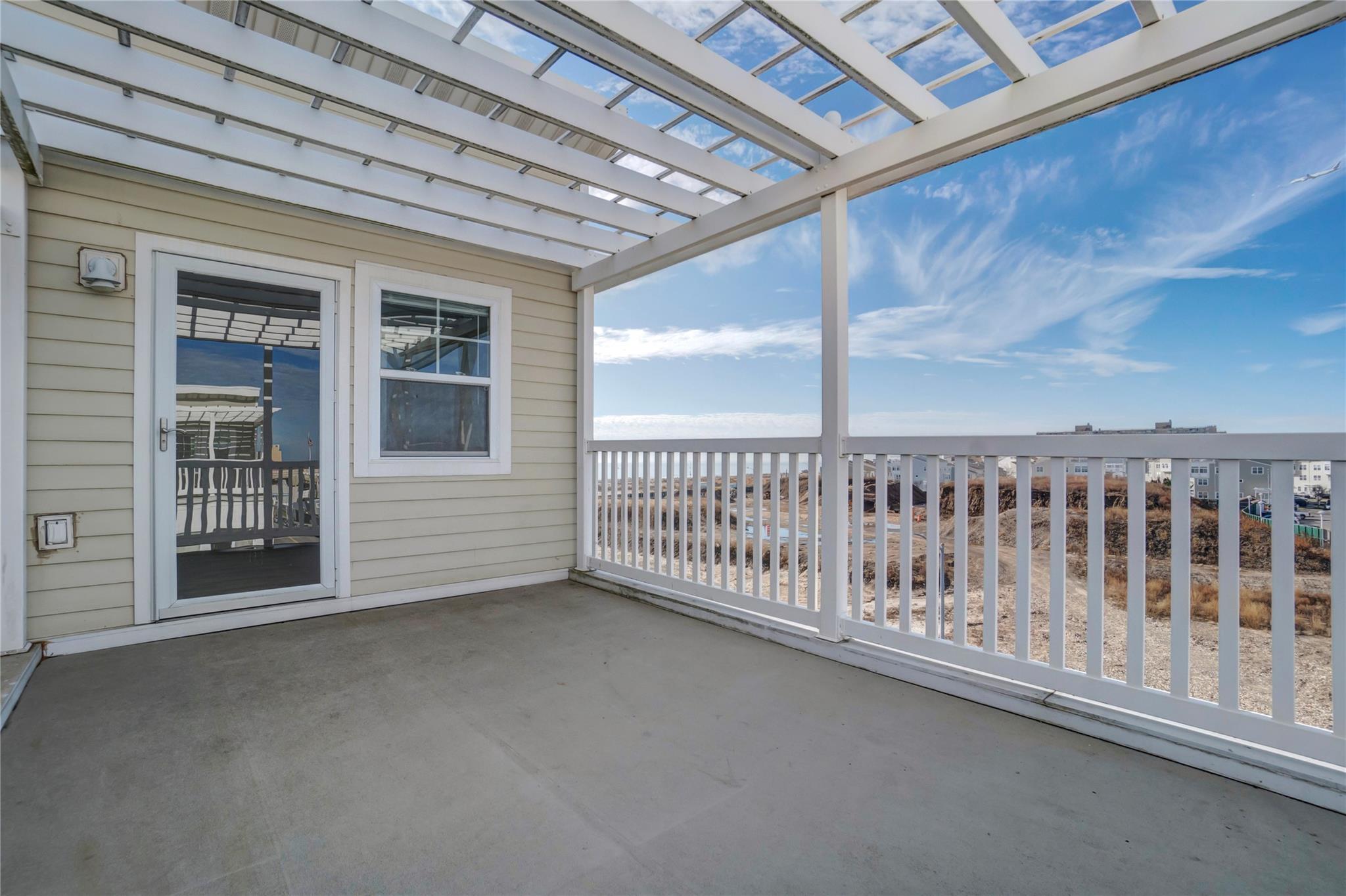 Balcony with a pergola and a patio