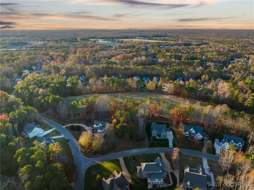 an aerial view of a house with a lake view