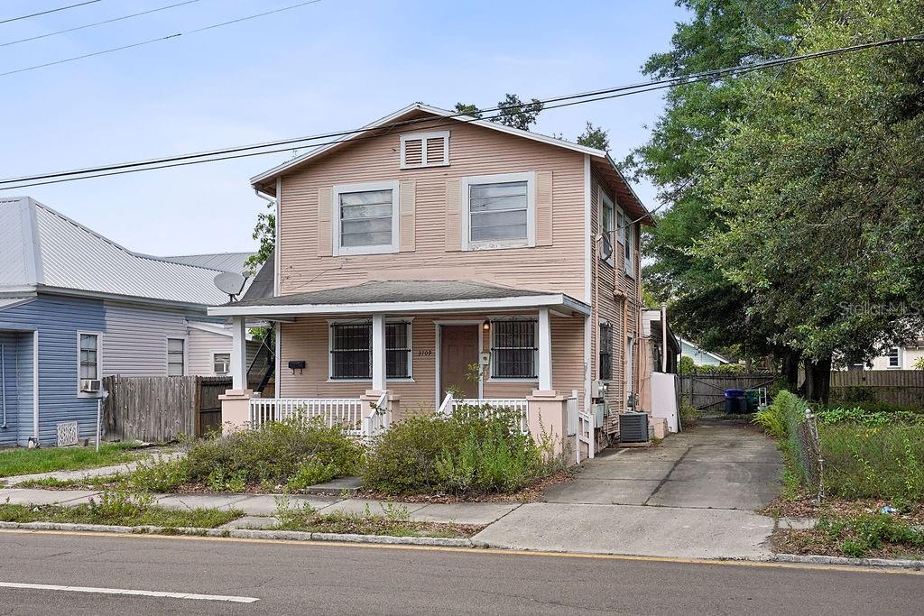 a front view of a house with garage