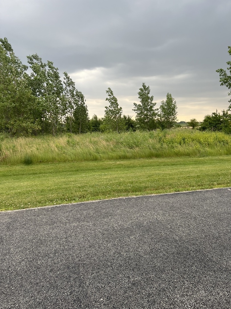 a view of a golf course with a lake