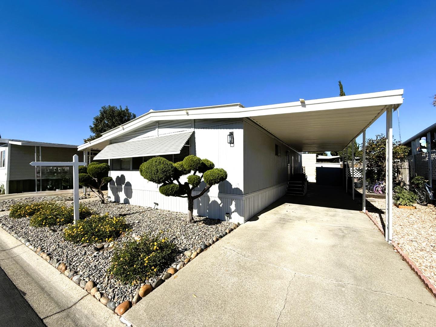 a view of a backyard with a patio