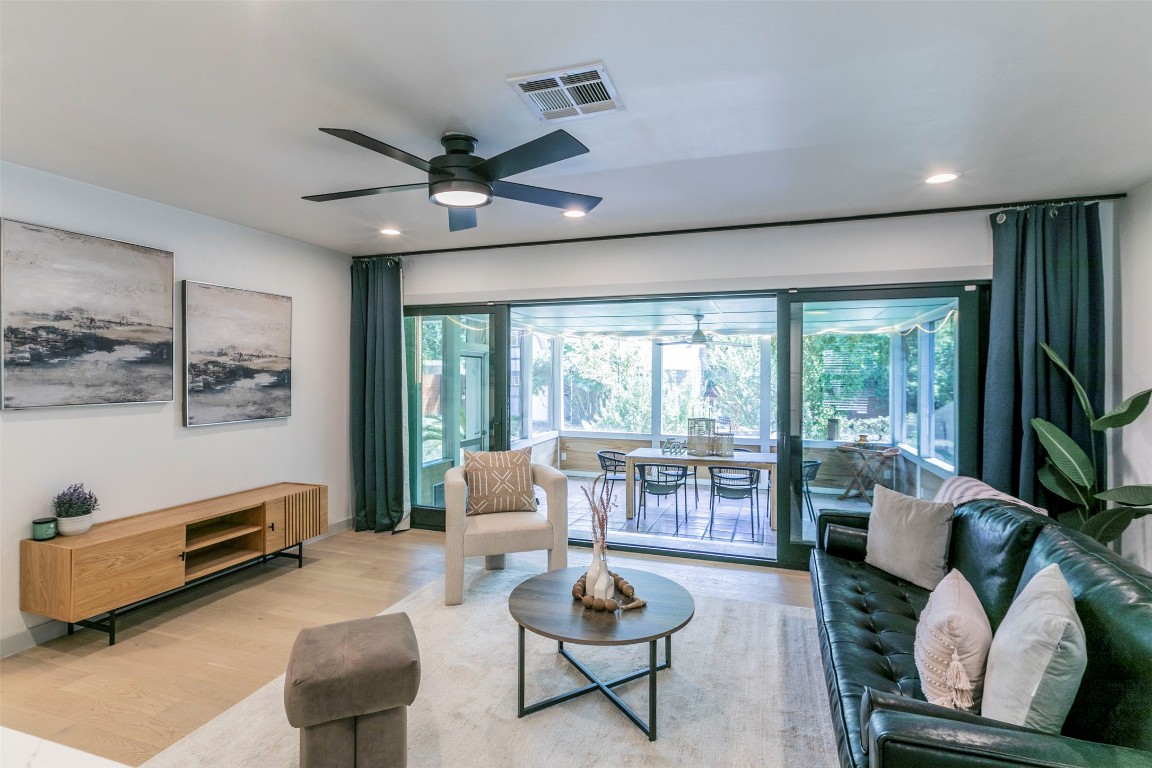 The living room opens to a beautiful screened-in patio and backyard. You'll feel serene both inside and outside of this home!