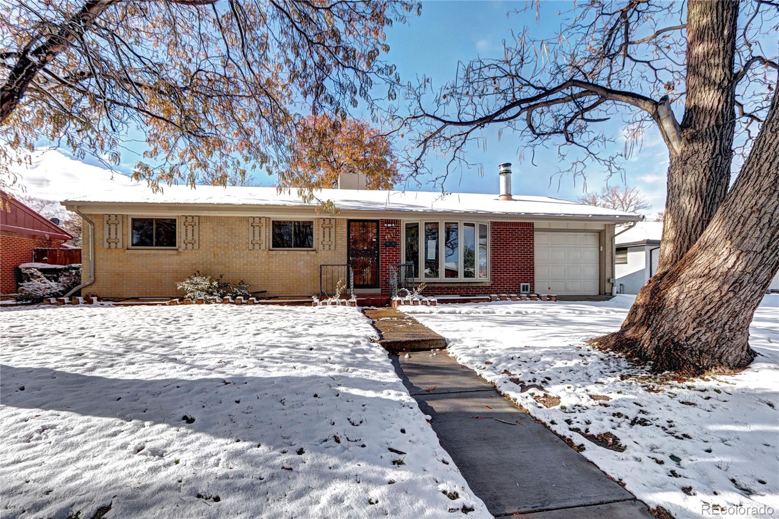 a view of a house with snow on the background