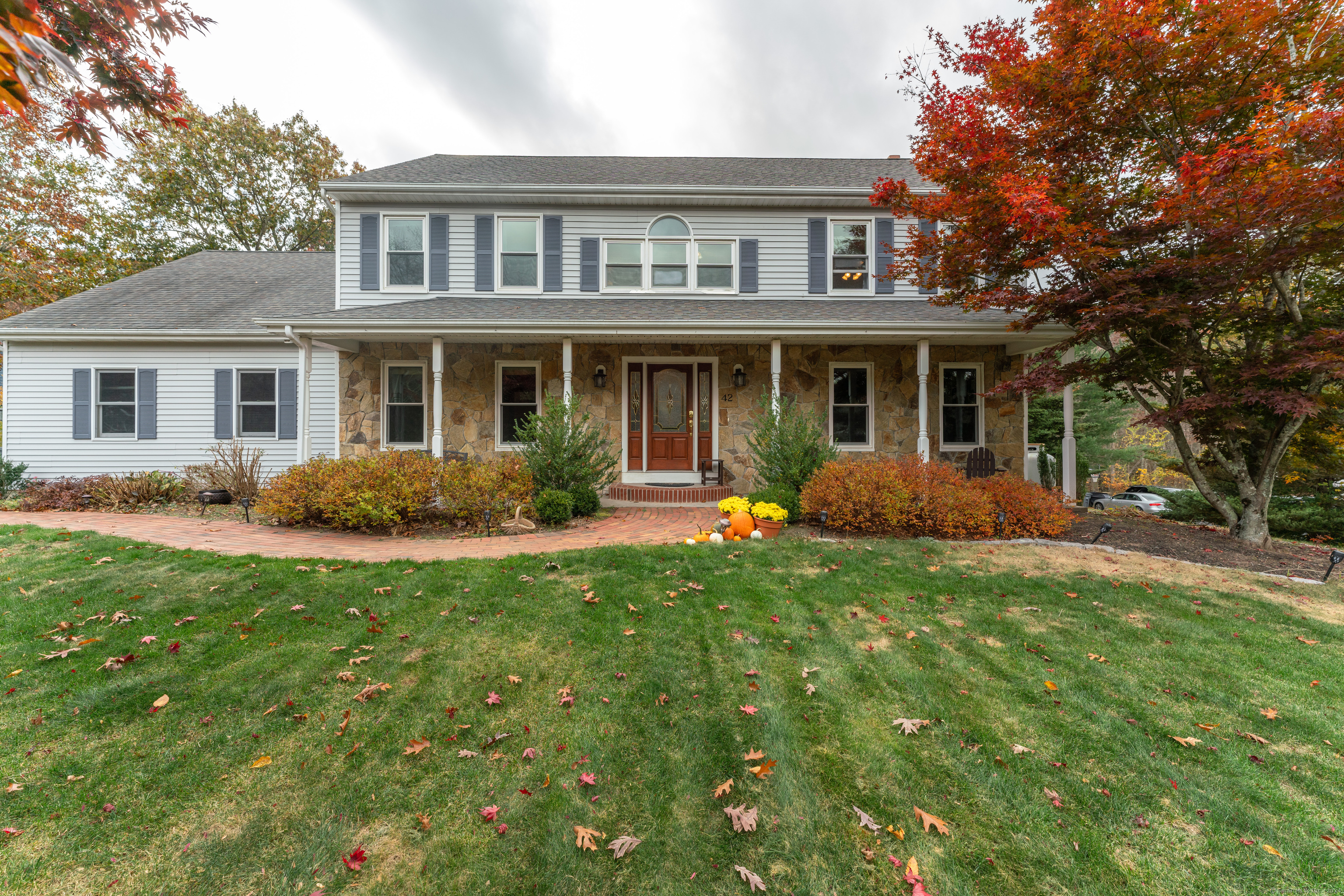 a front view of house with yard and green space