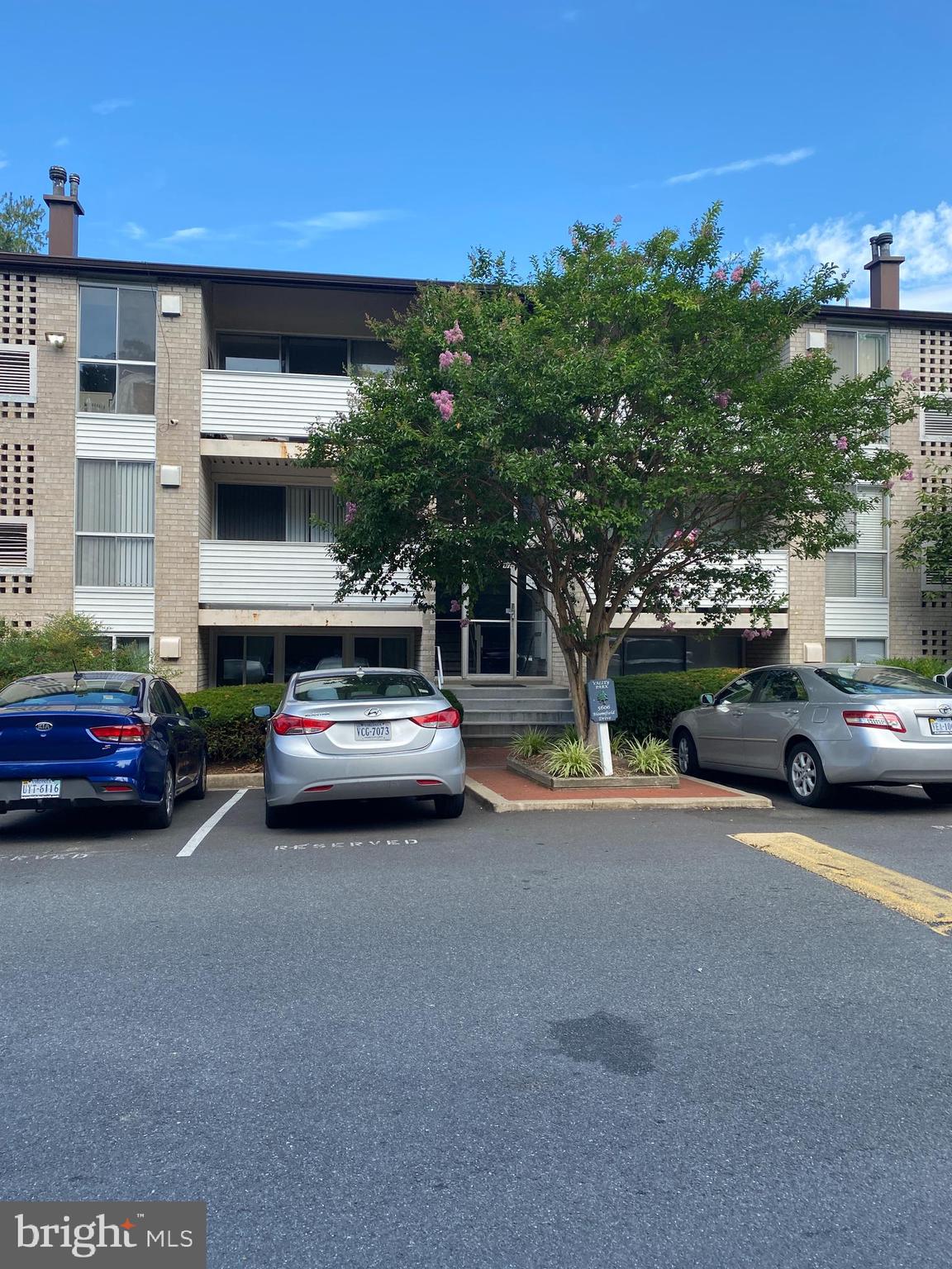 a view of a cars parked in front of a building