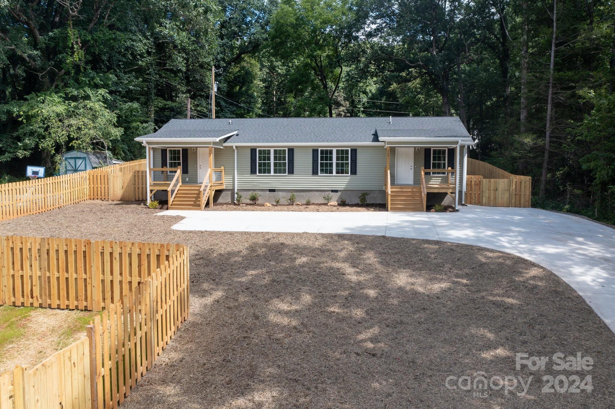 a front view of a house with yard