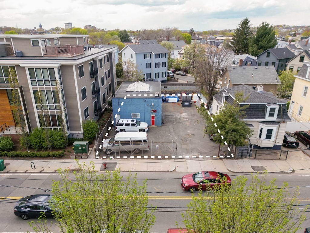 a aerial view of a house with a swimming pool