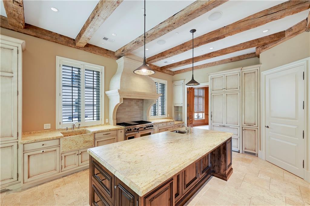 a bathroom with a sink a vanity and a bathtub