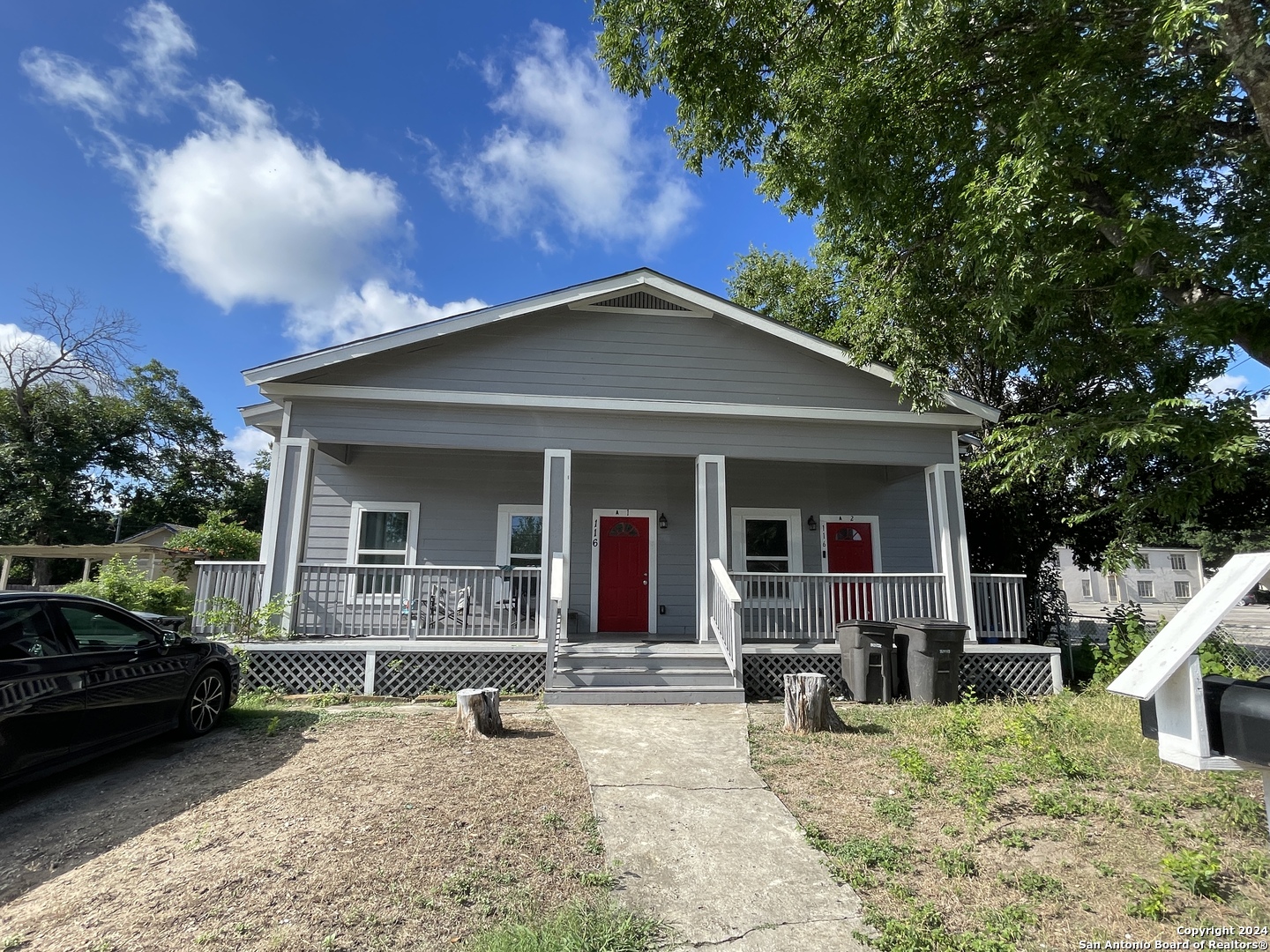 a front view of a house with garden