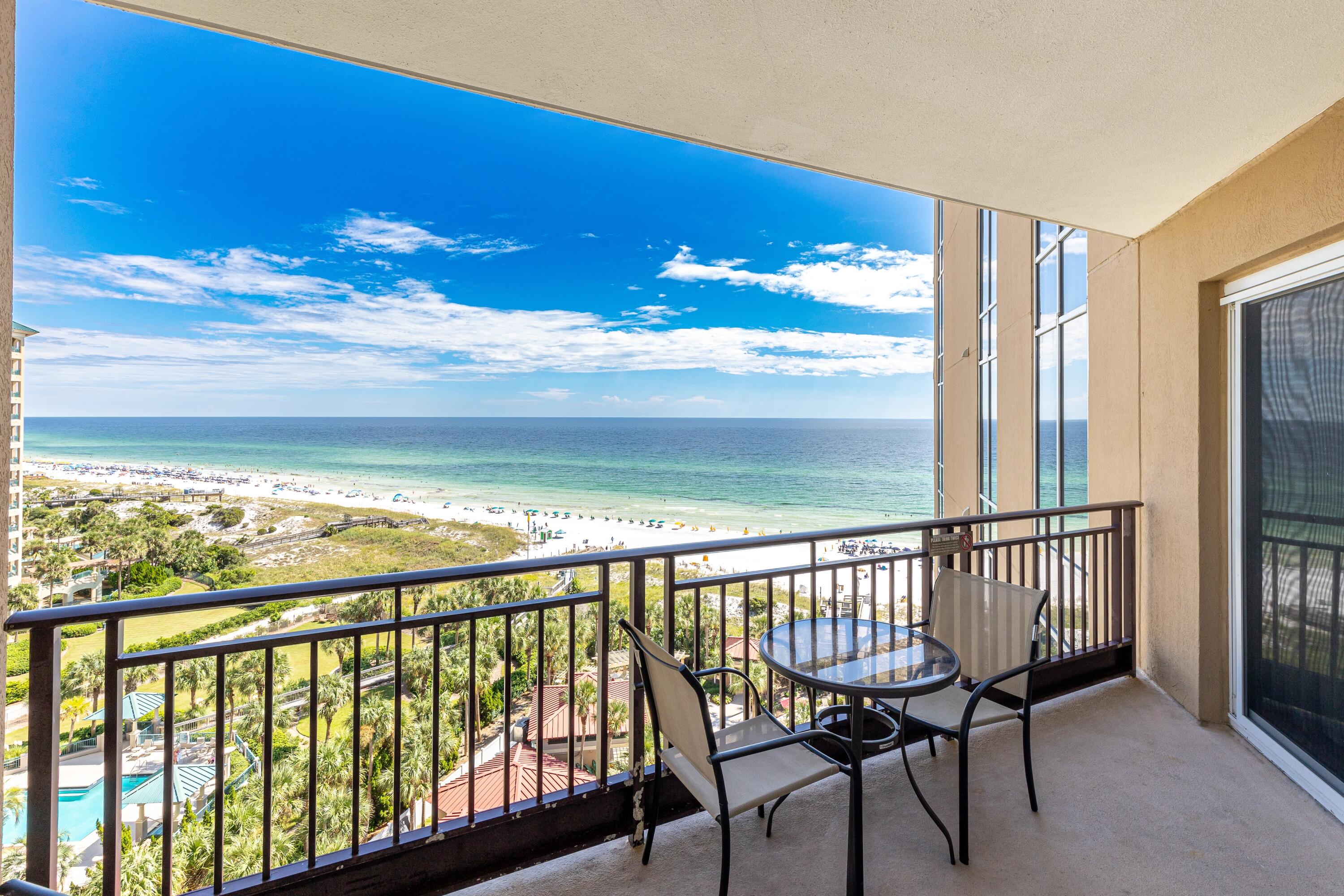 a view of a balcony with furniture