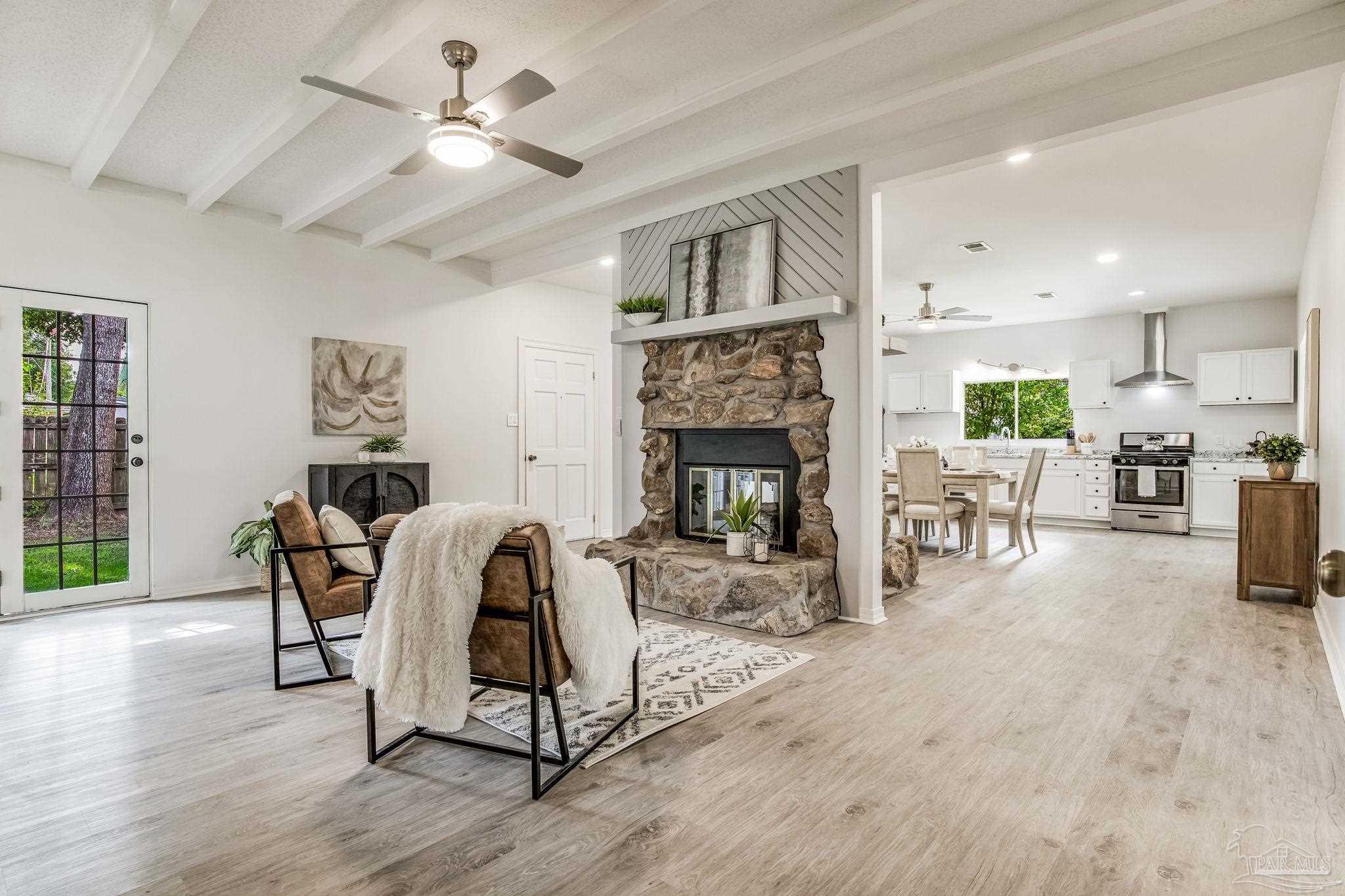 a living room with furniture and a fireplace