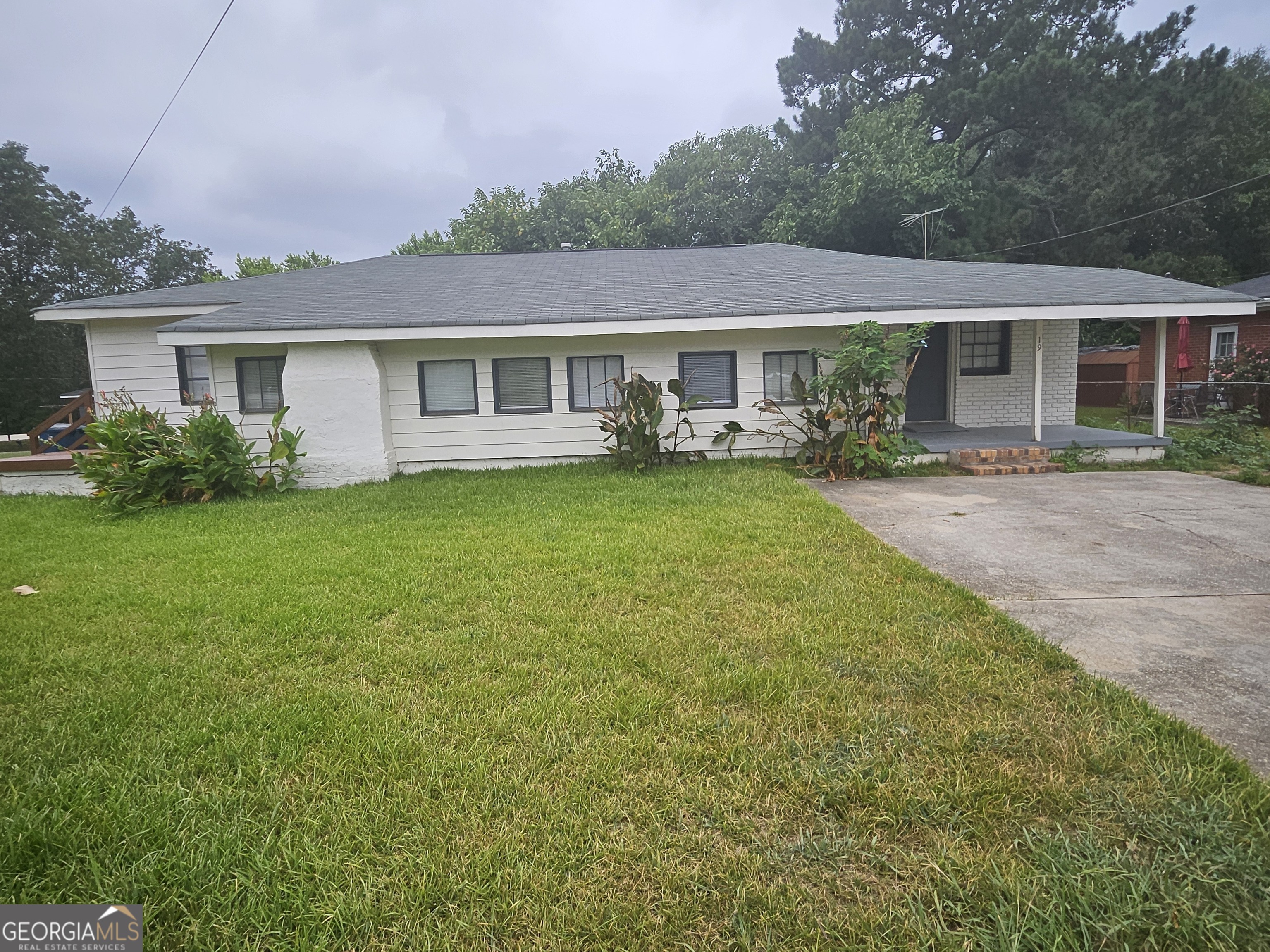 a front view of house with yard and seating