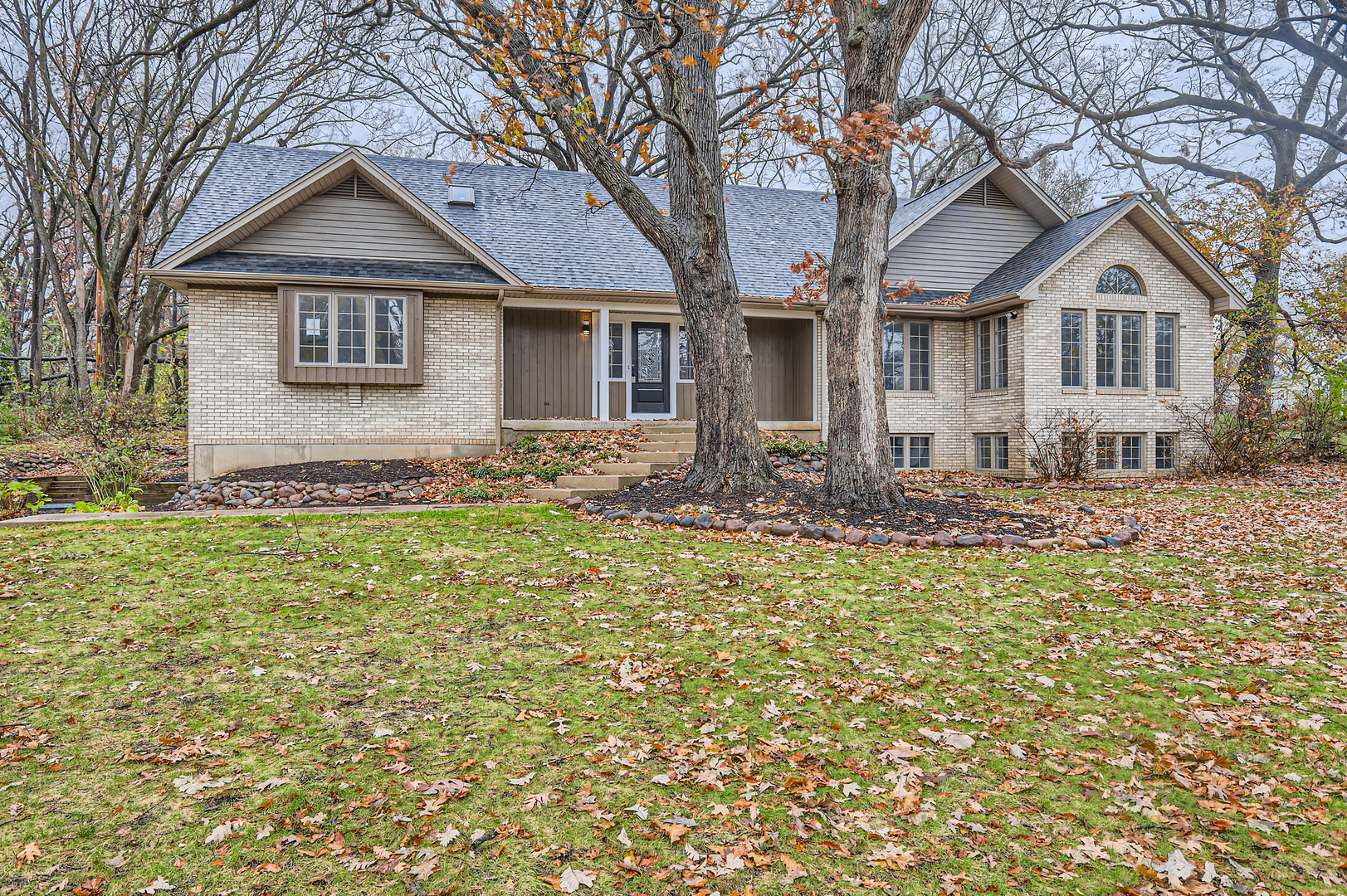 a front view of a house with a yard