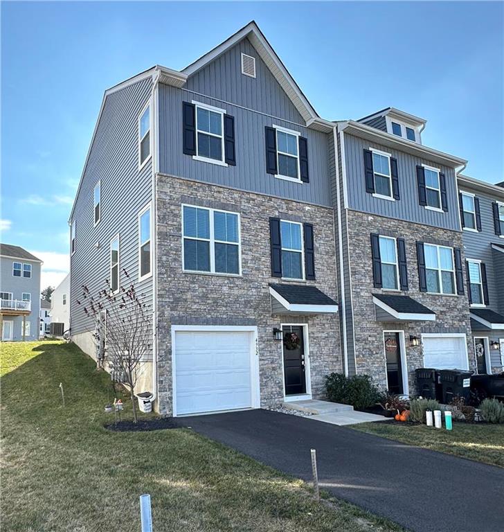 Immaculate end unit townhouse now available. Largest floor plan in this community.