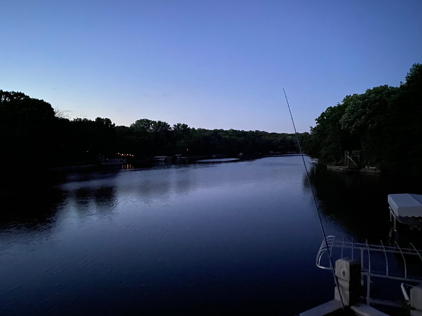 a view of a lake in front of a house