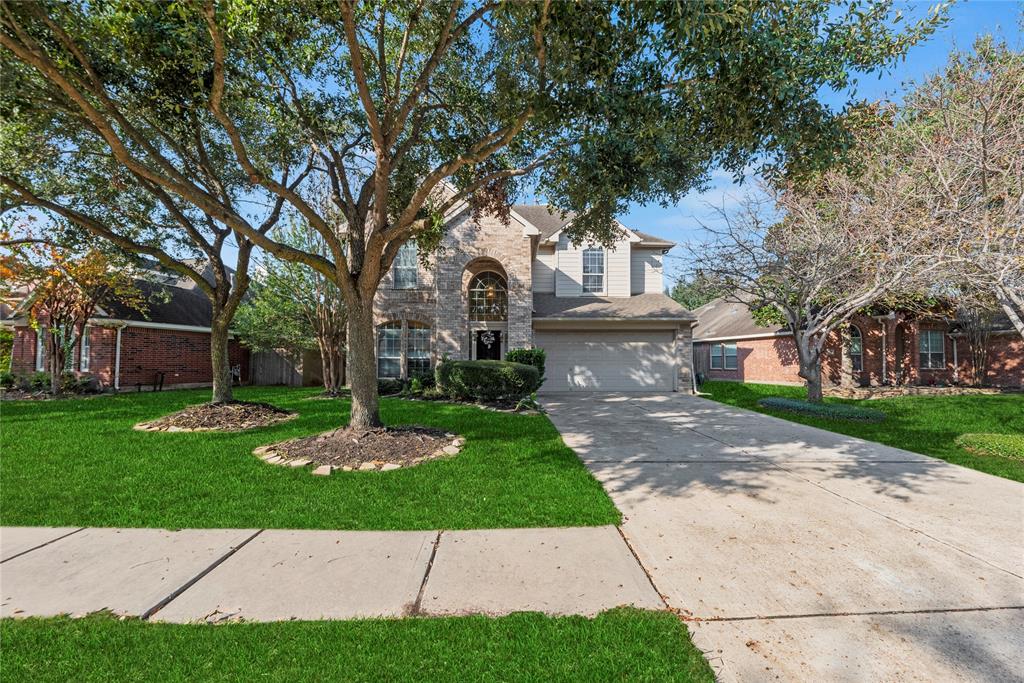 Welcome home to 7420 Hollow Cove Court in the Westgate community in Cypress!